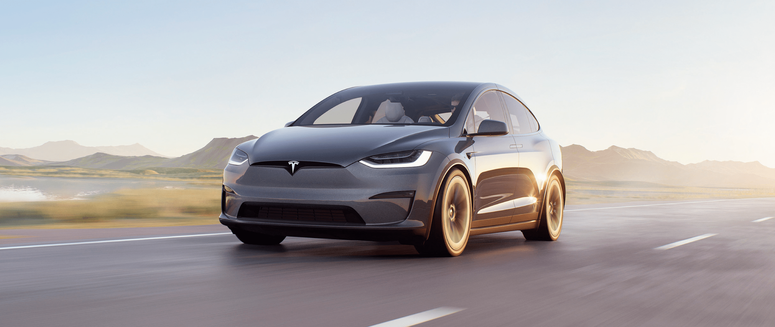 Electric car driving scenic road