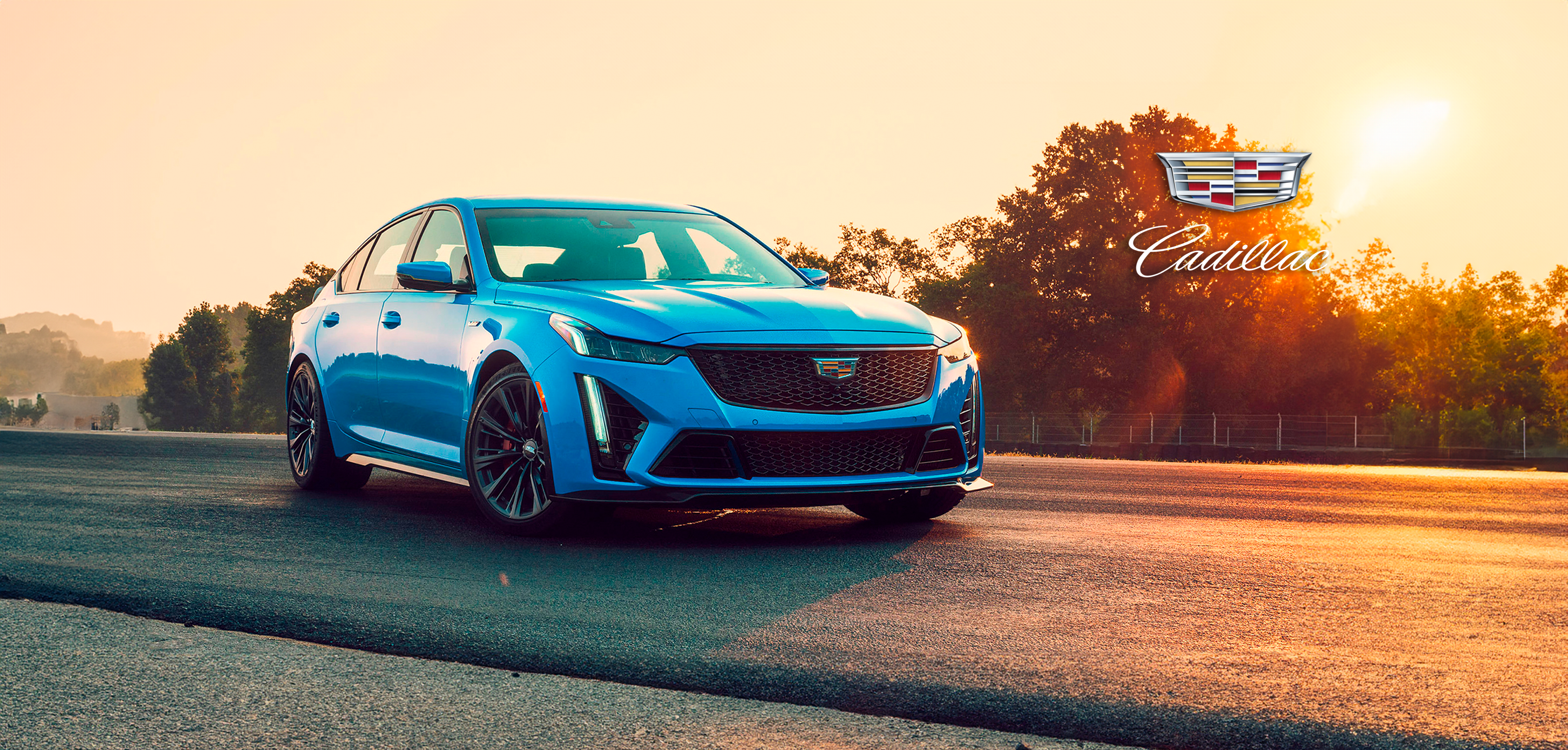 Blue Cadillac car at sunset