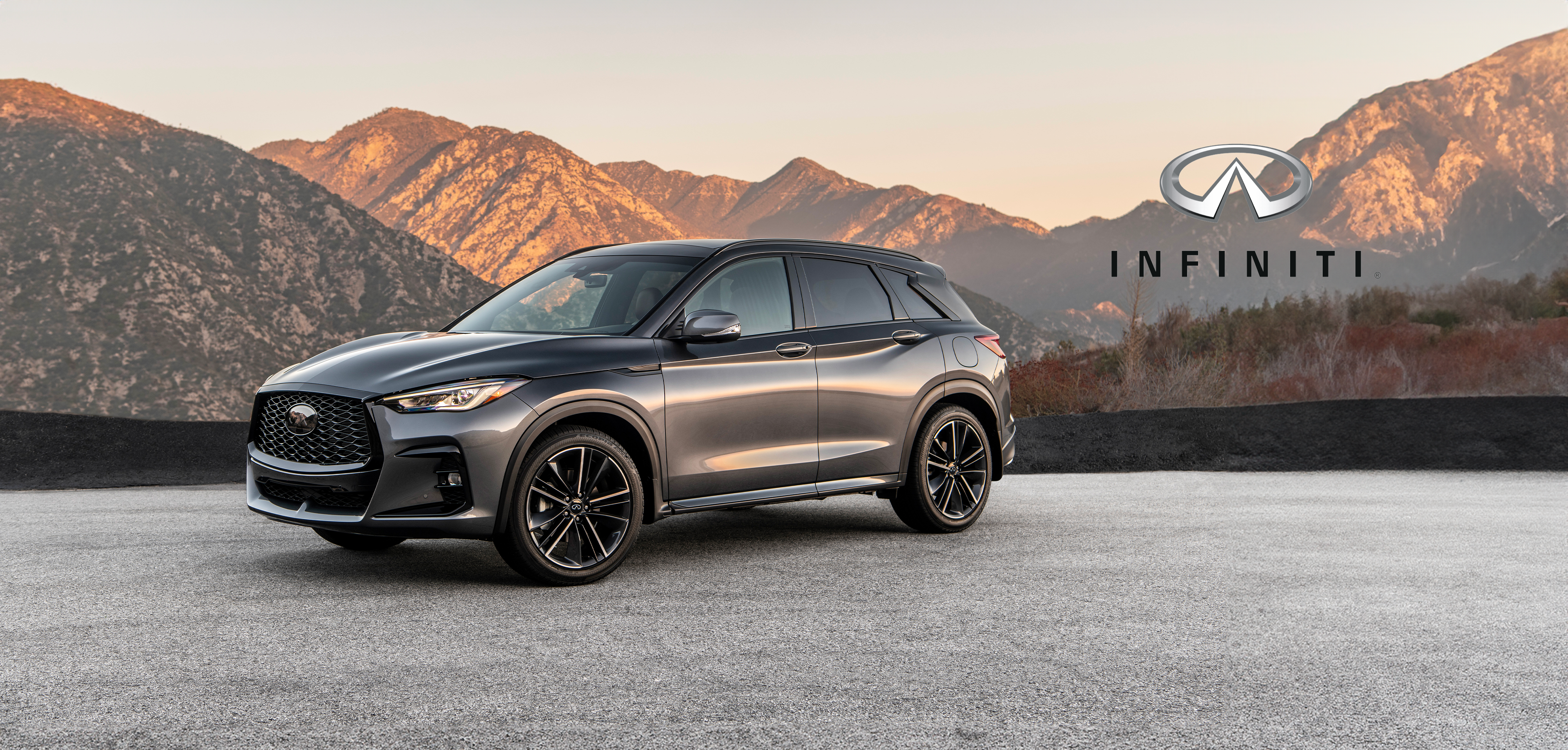 Luxury SUV with mountain backdrop