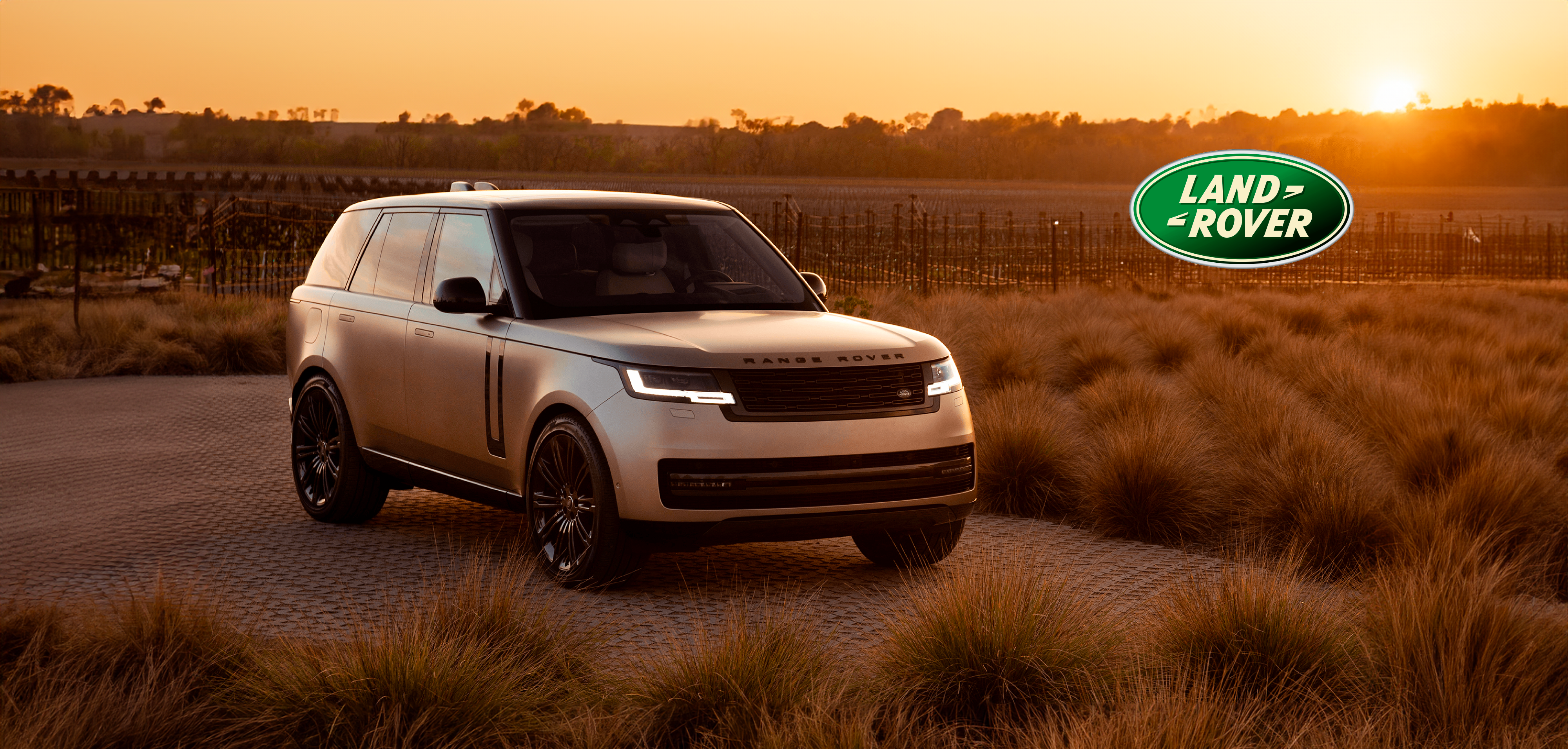 Luxury SUV at sunset landscape