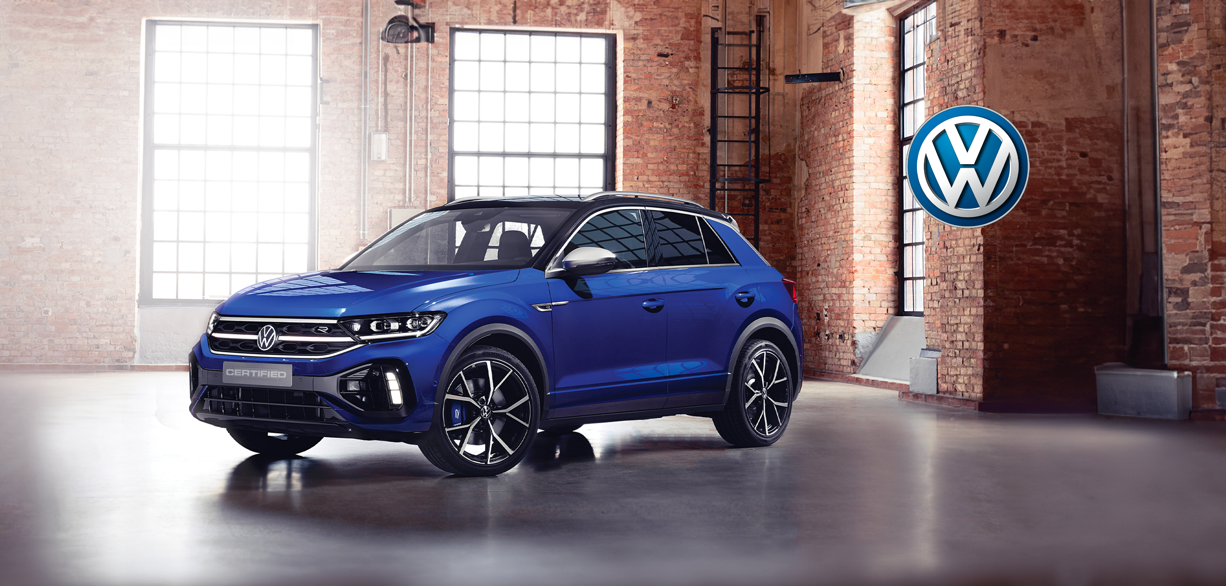 Blue SUV in industrial showroom
