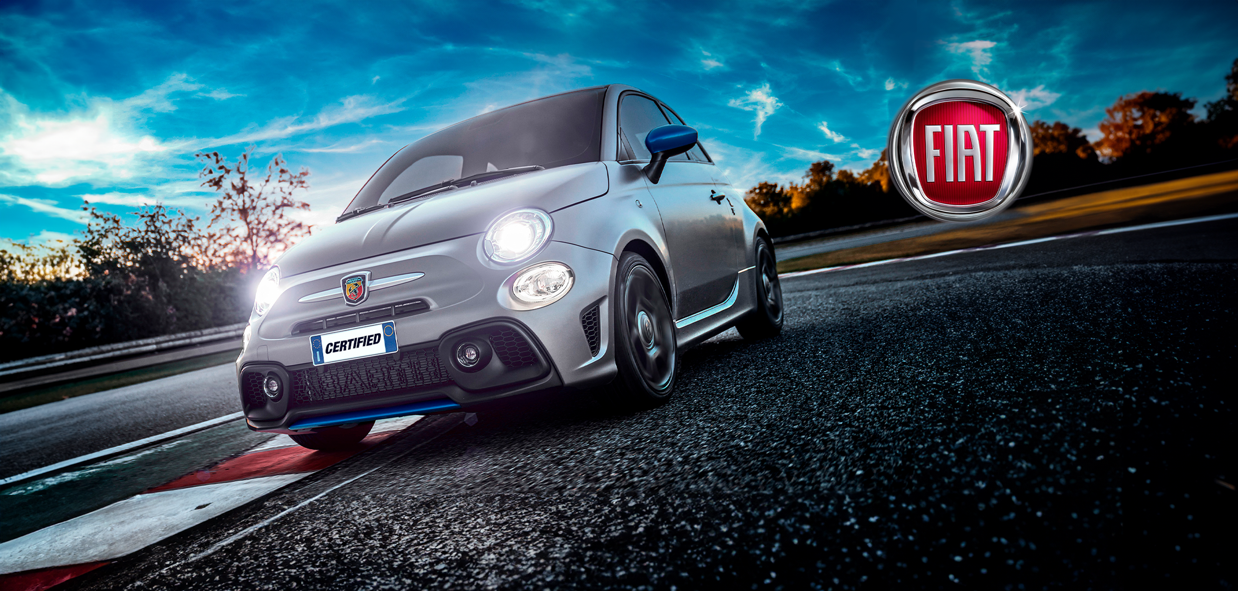 Fiat car driving on racetrack