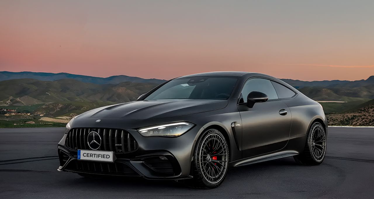 Luxury black sports car sunset