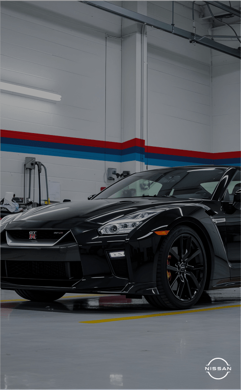 Black sports car in garage