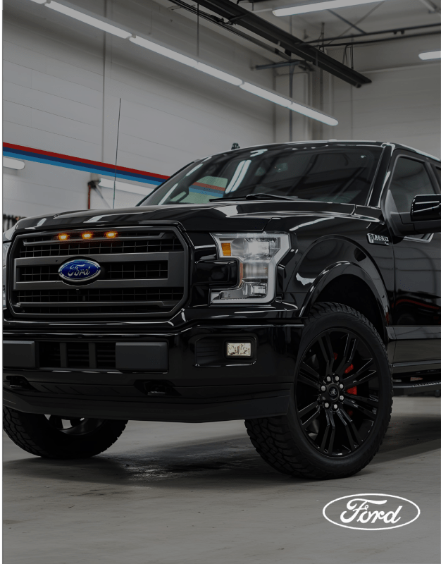 Black Ford truck in garage
