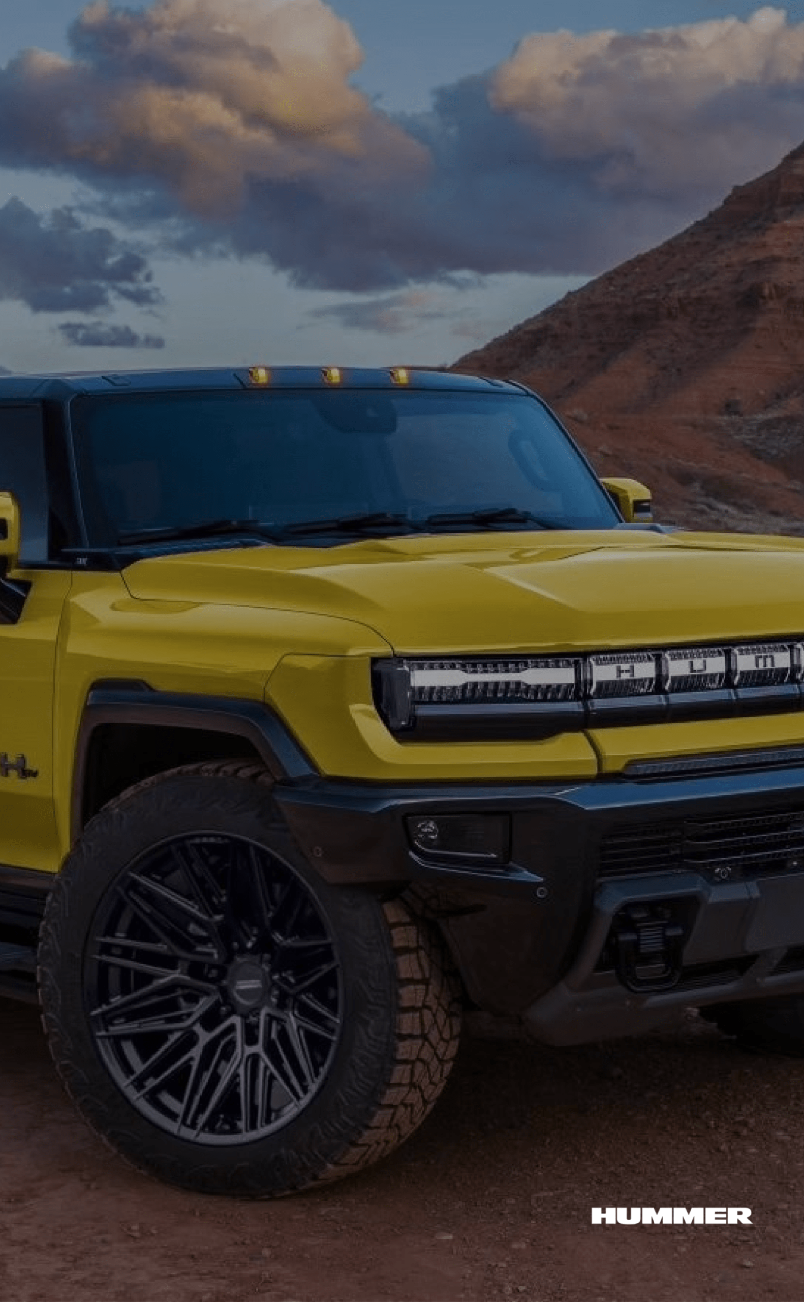 Yellow Hummer on rocky terrain
