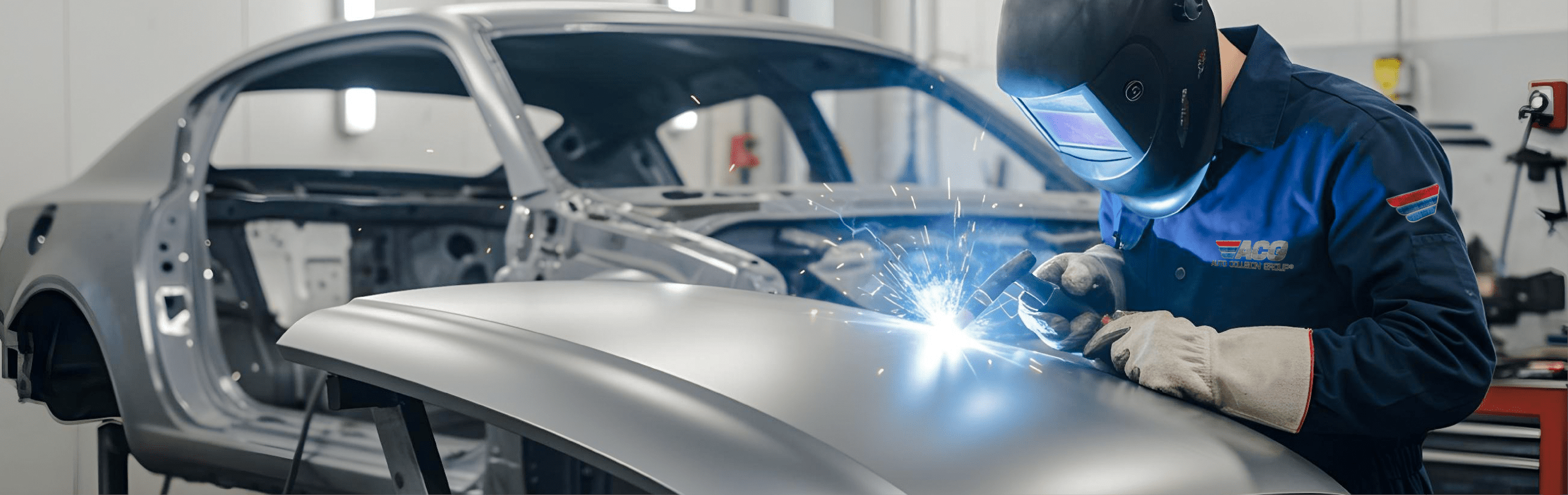 Car repair welding in progress